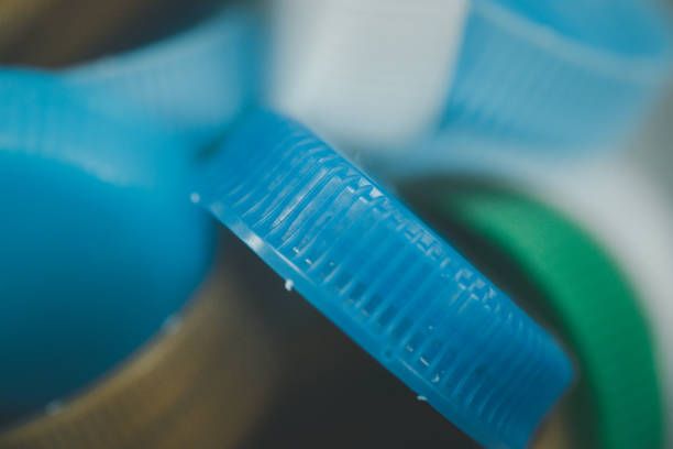 istock Plastic bottle caps. Concept of separate garbage collection. Waste disposal 1255932164