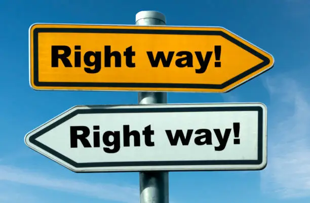two signs point in opposite directions
with the claim that it was the right way