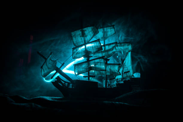 istock Black silhouette of the pirate ship in night 1255934068