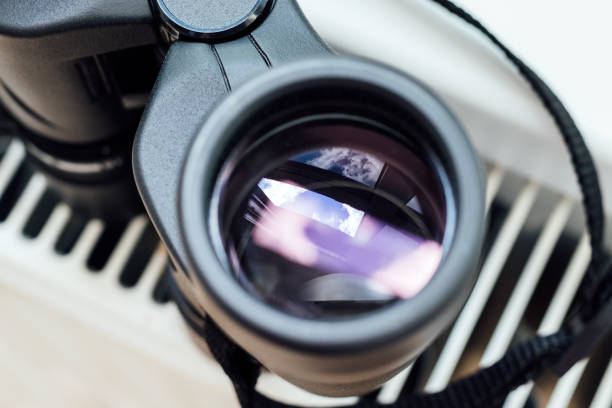 Coin Operated Binocular viewer or touristic telescope, trees and sea, panoramic view. Closeup.