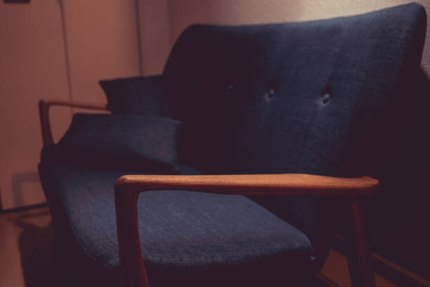 istock Stylish sofa that was illuminated by the lighting 1255934481
