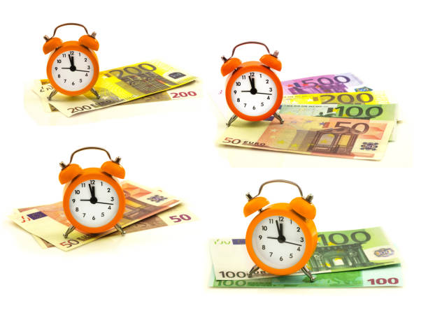 zestaw pomarańczowych budzików z papierowym pieniądzem euro 50, 100, 200, 500 - euro symbol crisis time debt zdjęcia i obrazy z banku zdjęć