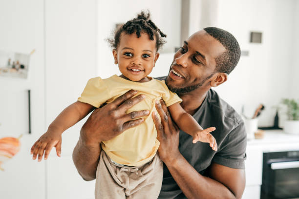 istock Cute little toddler and supportive dad 1255935403