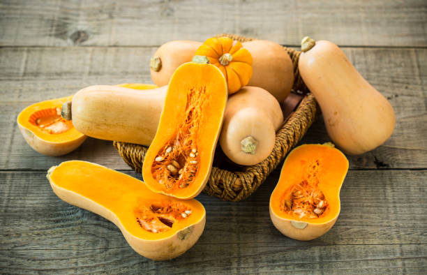 Fresh butternut squash on the wooden table stock photo