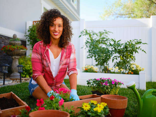 istock Young Woman in a Backyard Garden 1255936009