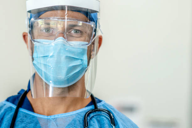 istock Caucasian male wearing full PPE - personal protective equipment 1255939764
