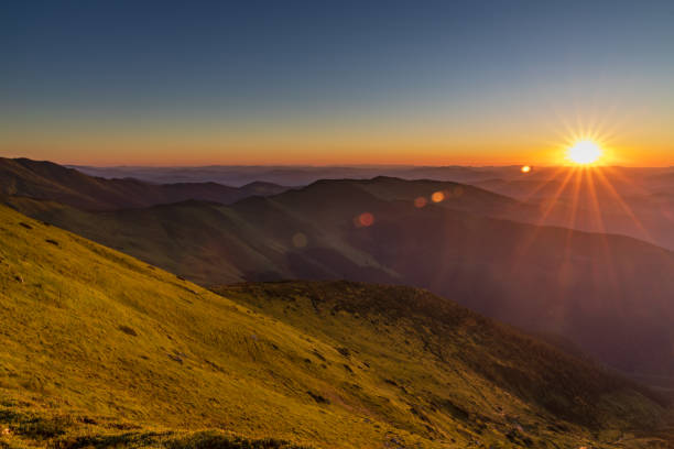istock Epic sunrise with mountain ridge 1255940114