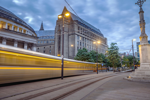 Tram passing by in Manchester St Peters Square, England.