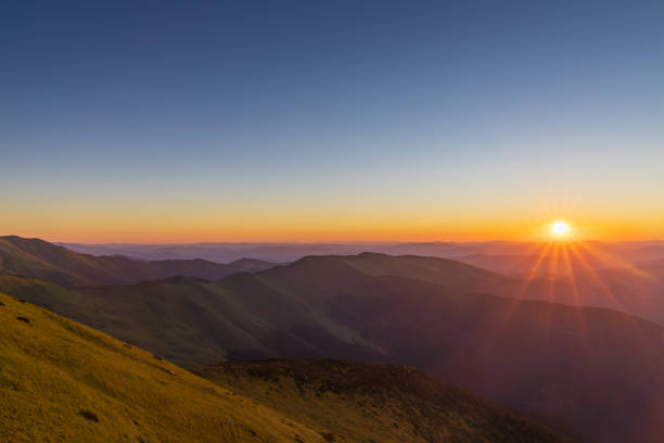 istock Epic sunrise with mountain ridge 1255946415