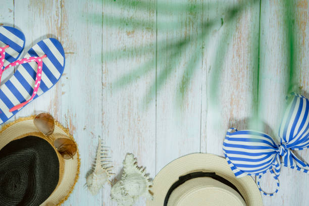 istock web banner and flat lay summer time with swimsuit and beach accessories on vintage blue wooden background 1255946870