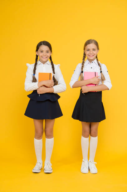 istock Most important thing one learns in school is self esteem support and friendship. Kids best friends classmates. School friendship. Friendship goals. Cute school girls with books. First day at school 1255947050