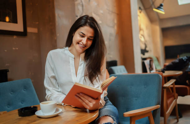 istock Beautiful woman reading romantic literature 1255948936