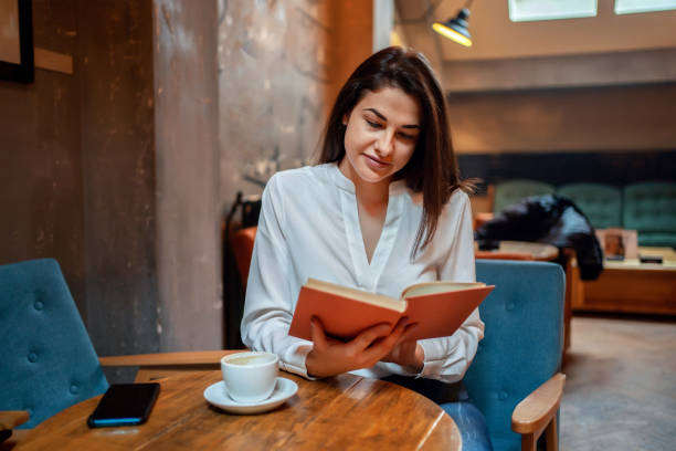 istock Beautiful woman reading romantic literature 1255948953