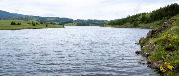 istock River and mountains on a sunny day stock photo 1255950256