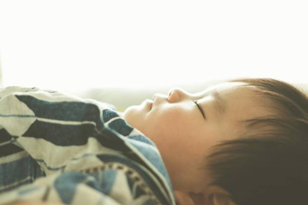 Asian baby boy sleeping in the noon