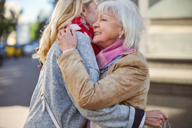 istock Two beautiful happy women having good time together 1255953885