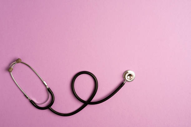 istock Medicine accessory, stethoscope, lilac background with copy space. top view 1255955710