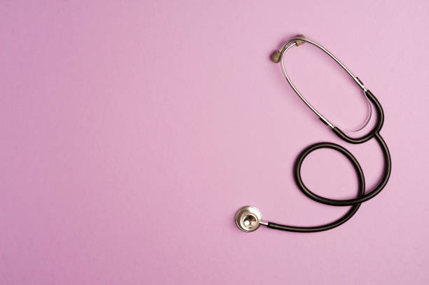 istock Medicine accessory, stethoscope, lilac background with copy space. top view 1255955722