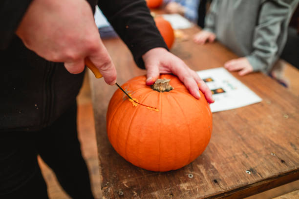 tagliare nella zucca - gourd halloween fall holidays and celebrations foto e immagini stock