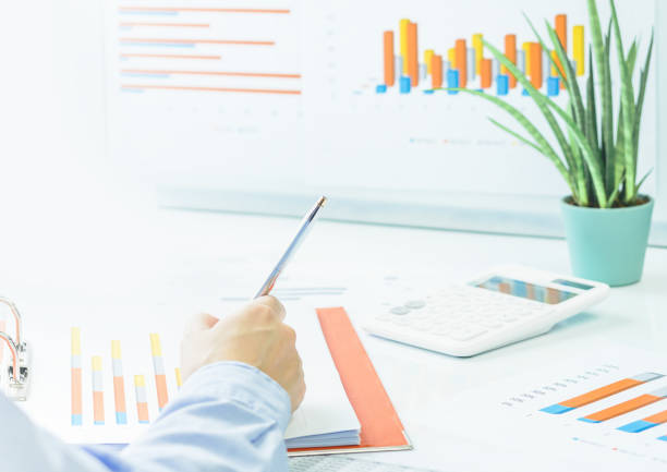 istock Finance and business. Financial office space with graphs. rear view 1255956260