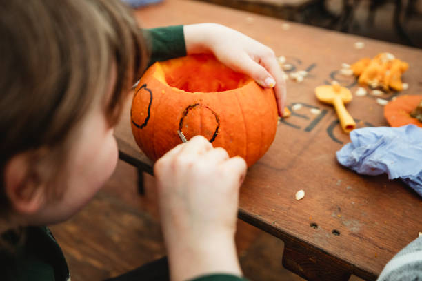 istock Carving out Pumpkin Eyes 1255956506