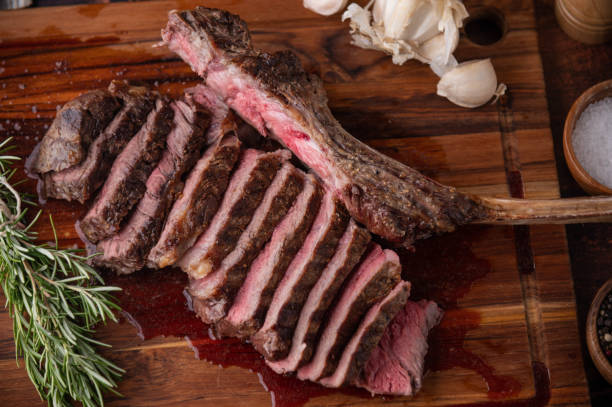 istock grilled tomahawk steak on wooden board 1255956540