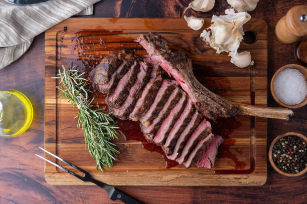 istock grilled tomahawk steak on wooden board 1255958578