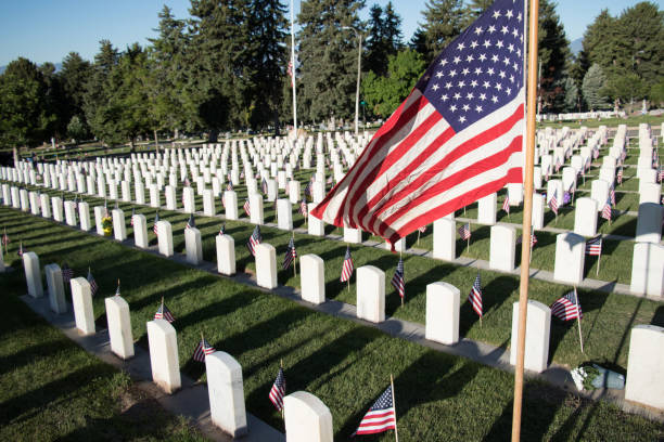 istock Military Headstones Decorated with Flags for Memorial Day 1255962304