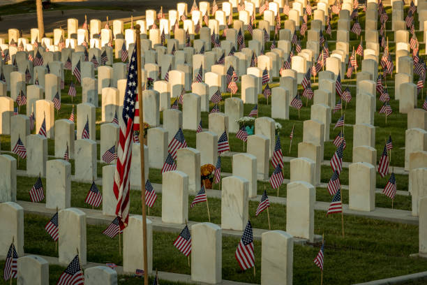 istock Military Headstones Decorated with Flags for Memorial Day 1255962343