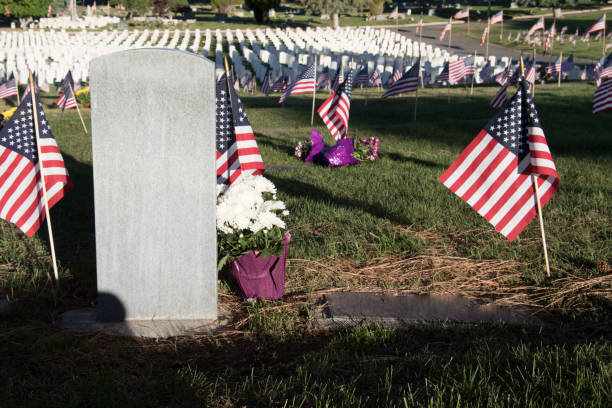 istock Military Headstones Decorated with Flags for Memorial Day 1255962387