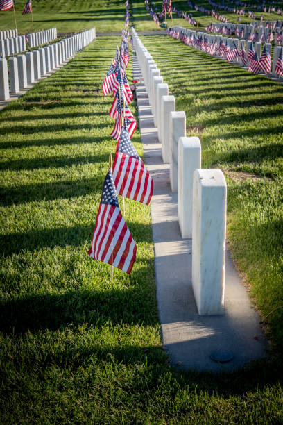 istock Military Headstones Decorated with Flags for Memorial Day 1255962571