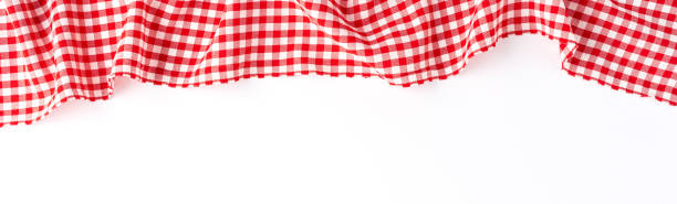 istock Red checkered tablecloth isolated on white background. Banner 1255964996