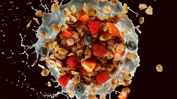 istock Freeze motion of rotating cereal pieces with milk splash 1255965086