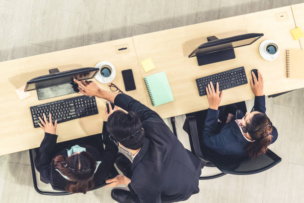istock Business people wearing headset shot from top view 1255965469