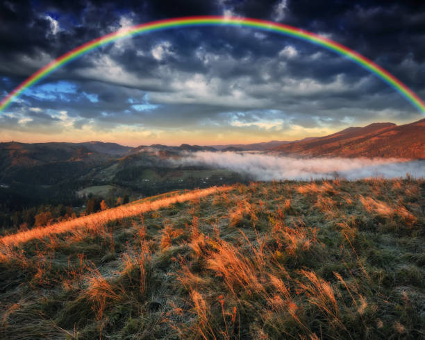 istock Rainbow over the Mountains. autumn morning in the Carpathians 1255965864
