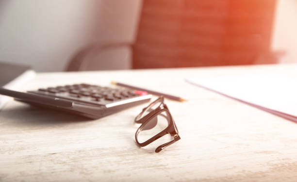 istock man hand calculator with glasses 1255967933