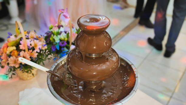 chocolate fountain at a wedding celebration in europe - wedding reception fountain chocolate candy wedding imagens e fotografias de stock