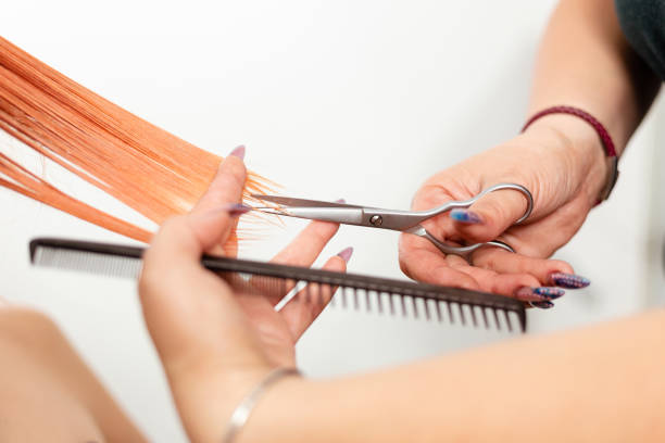 istock Cutting damaged hair ends 1255976088
