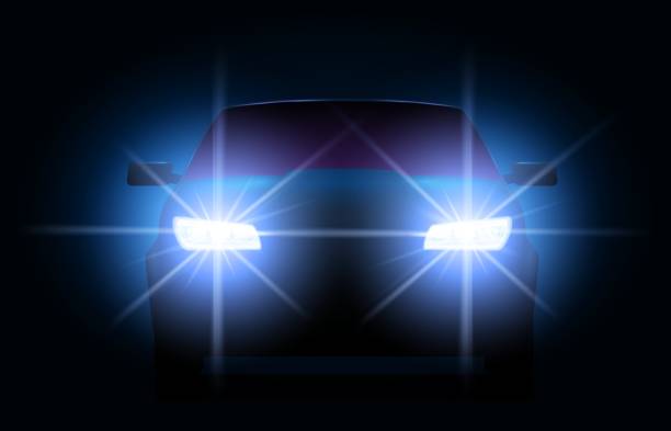 istock Car lights. Night urban scene with automobile or vehicle silhouette with bright shining headlights. Auto front 1255979812