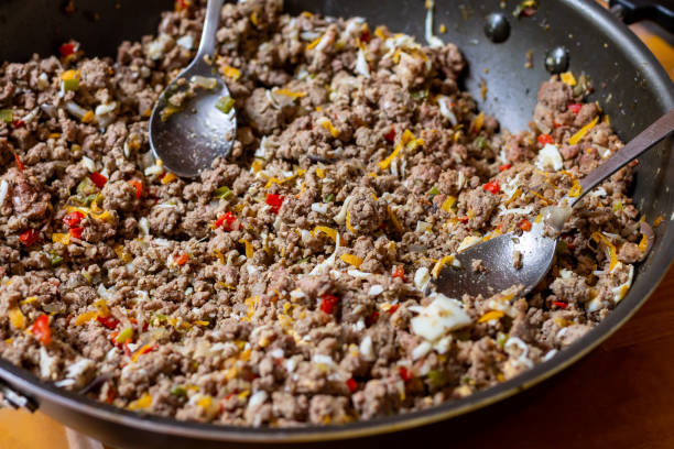 istock Frying pan filled with Mexican meat burritos. Tex-Mex Food Concept 1255983185