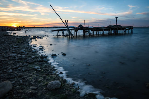 istock Sunset on the Etang de l'Or in Perols (Occitanie, France) 1255984590