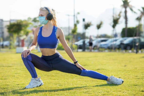 istock Young woman stretching outdoor 1255986022