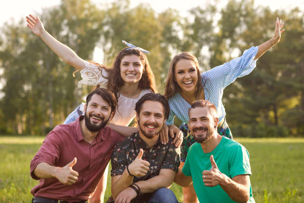 istock Friendly people having fun together in summer park 1255987473