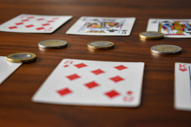 istock Playing cards with euro coins 1255987529