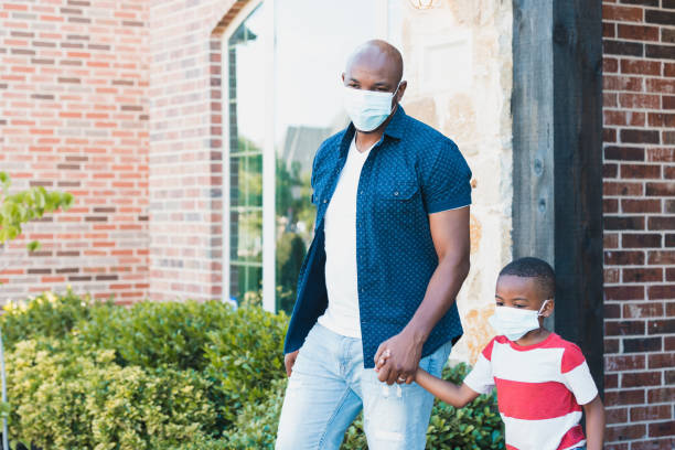 istock Going out for a walk, dad holds son's hand 1255989123