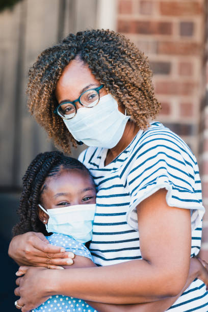 istock Mom and daughter embracing 1255989277