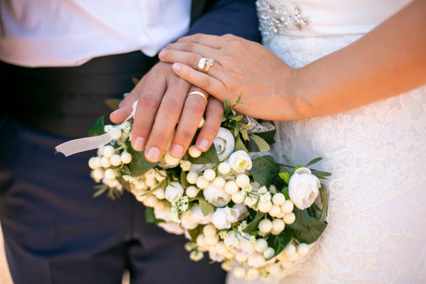 istock Bride and groom side by side with flowers in their hands in Turkey 1255990857