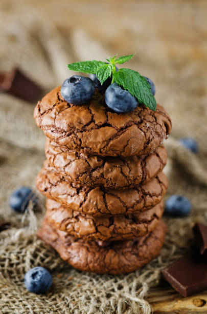 istock Chocolate brownie cookies with berries and mint leaves 1255991562