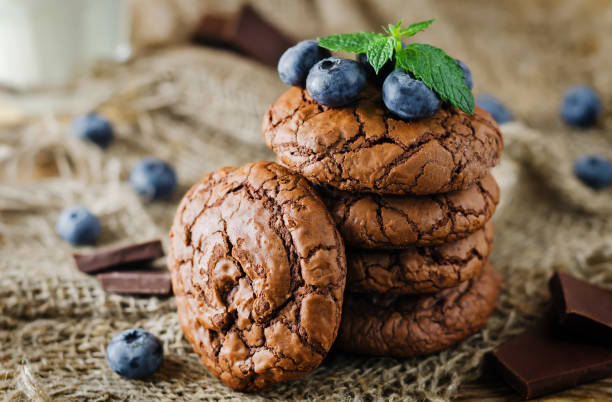 istock Chocolate brownie cookies with berries and mint leaves 1255991563