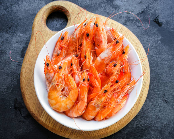 istock shrimp cooked seafood ready to eat prawn Menu serving size. food background top view copy space organic healthy eating raw pescatarian 1255991829